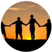 4 people holding hands over the sunset